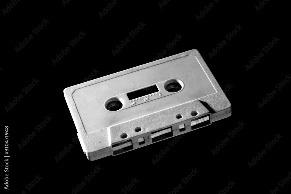 Obraz premium old white audio cassette on dark background