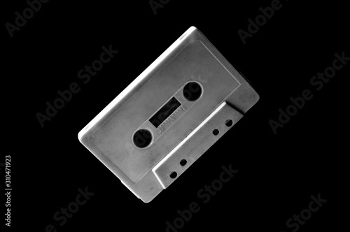 white audio cassette on dark background