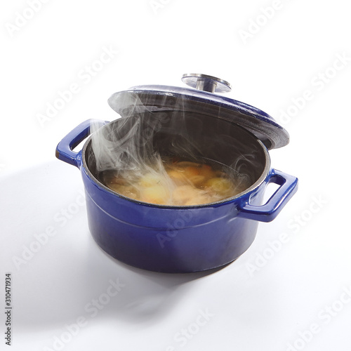 Chicken Soup in a Blue Pan Isolated Side View photo