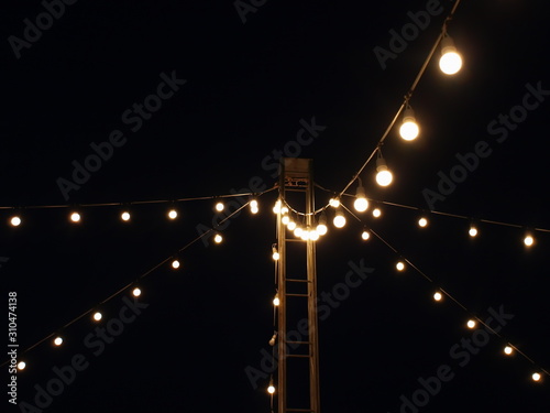 Soft focus light bulbs that decorate during celebrations or at night parties On the night background