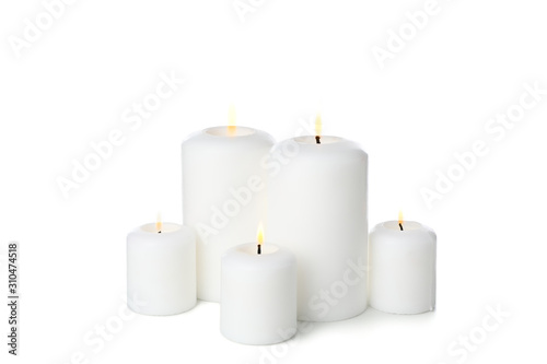 Group of different candles isolated on white background