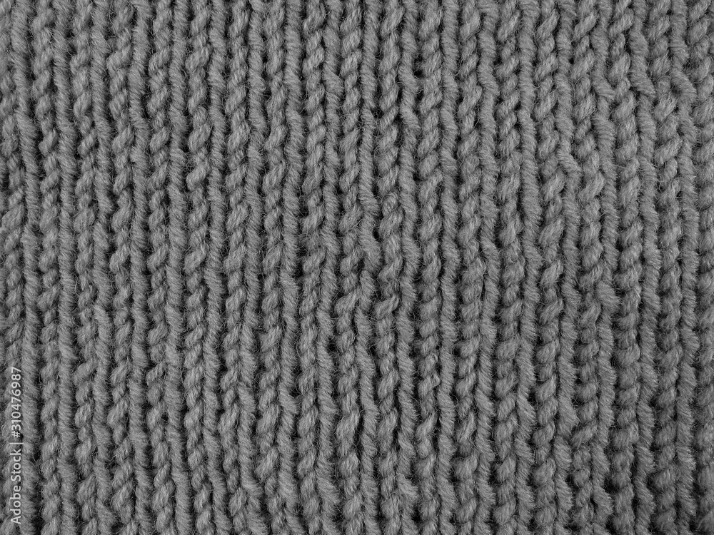Background knitted from blue woolen threads. Suitable for decoration themes: winter, comfort, hobby, handmade, new year. Background knitted from blue woolen threads. Suitable for decoration themes: winter, comfort, hobby, handmade, new year.