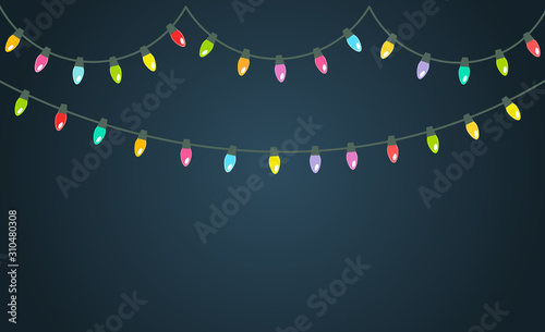 Christmas colorful lights shining on the dark background