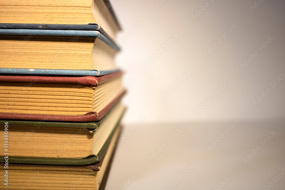 Naklejka premium stack of books on white background close up