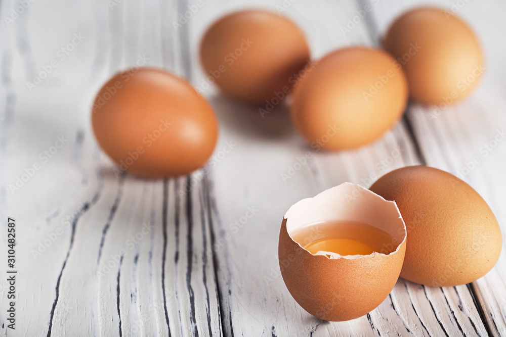 Fresh chicken eggs on a wooden table. Fresh chicken eggs on a wooden table.