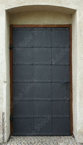 Metal forged medieval door