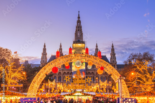 Festive cityscape - view of the Vienna Christmas World and Vienna City Hall (Wiener Rathaus) on Rathausplatz, Austria photo