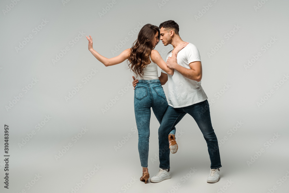 dancers dancing bachata on grey background with copy space dancers dancing bachata on grey background with copy space