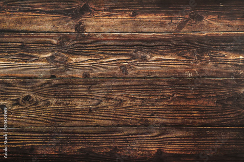 Dark brown wood surface. Texture for the background. Dark brown wooden texture for background.