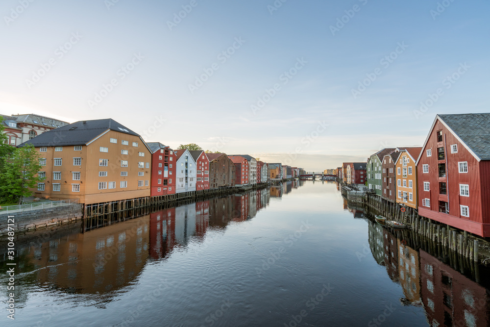 Colorful wooden buildings near Nidelva river in the city of Bakklandet/Trondheim in Norway. Architecture, buildings, travel and photography concept.