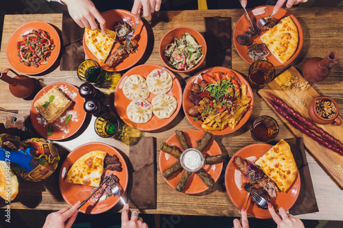 Canvastavla View from above of georgian cuisine on brown wooden table