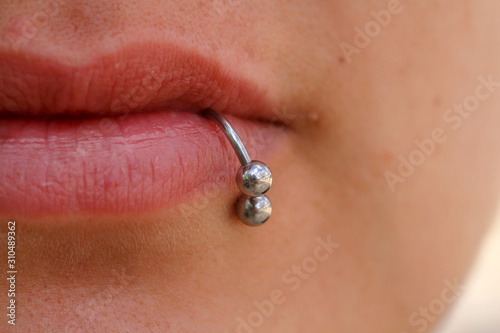 Close-up of lips and piercings