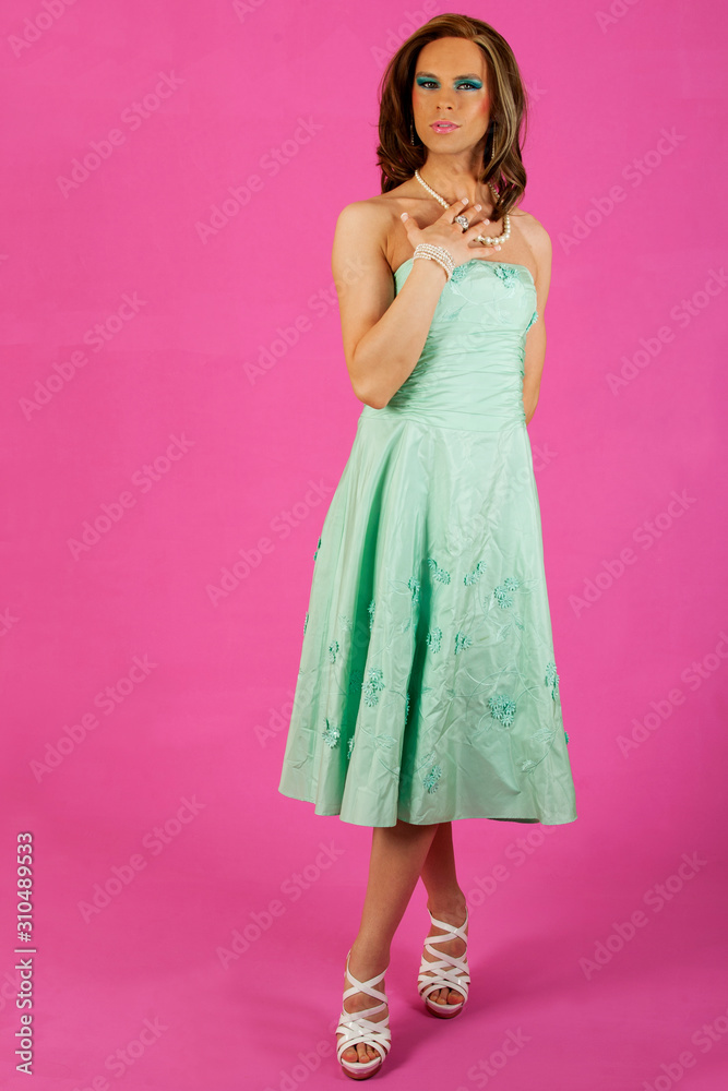 Fototapeta premium beautiful cross dresser wearing a nice dress and makeup
