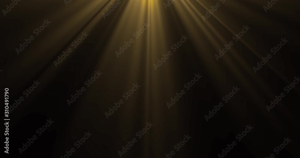 Gold yellow light, sun beams from above on black background. Golden sunbeam light rays magic glow radiance effect