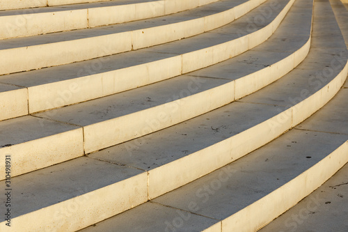 Curved staircase. Stair-step architectural structure. Architectural background.