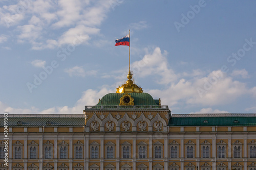 2019.09.07, Moscow, Russia. A national flag on the top of Grand Kremlin Palace, view from across the Moskva River.