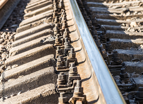 Fastenings of metal railway rails close-up