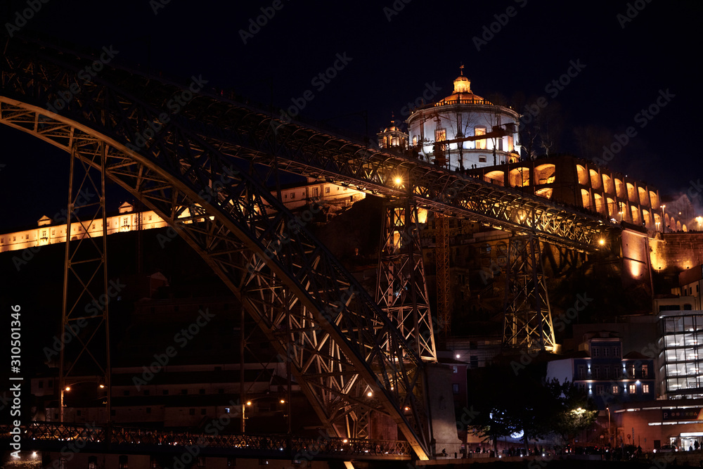Night photograph of the Don Luis I bridge in Porto, Portugal.