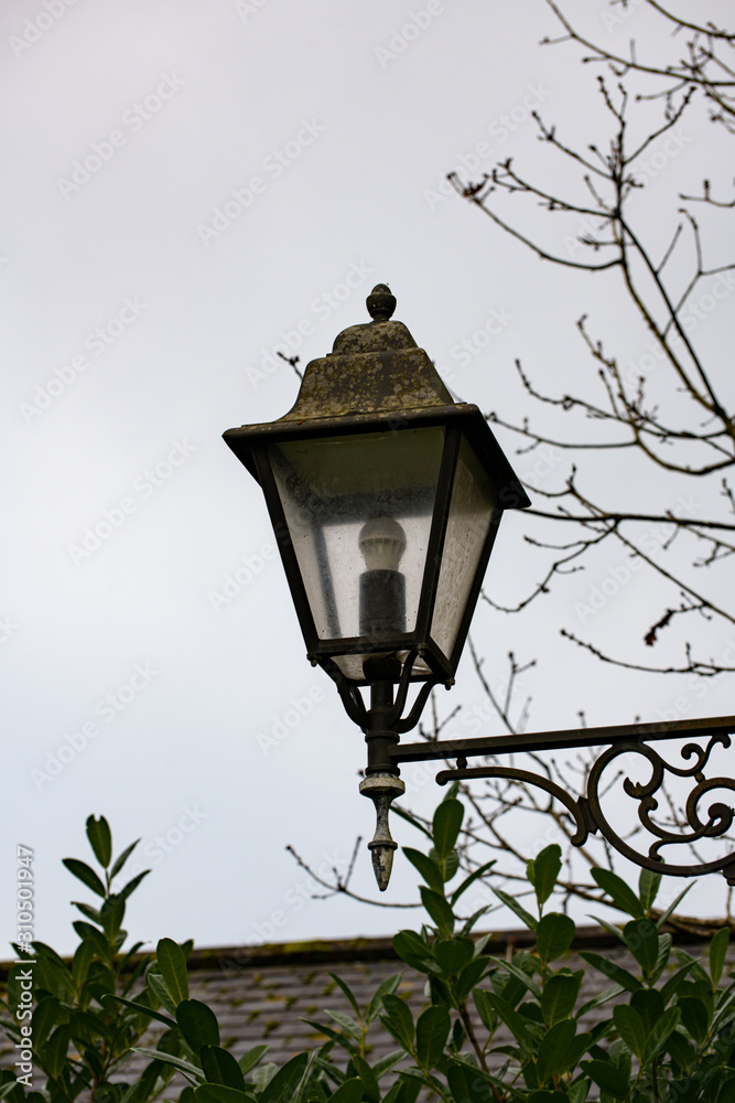Old street lamp against sky