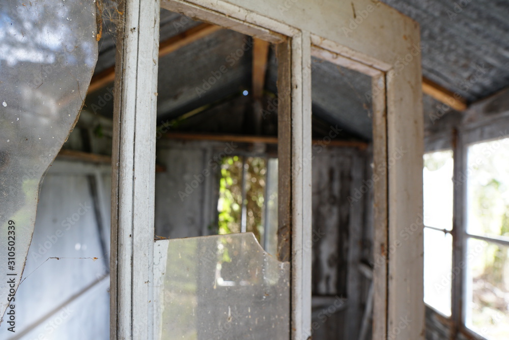 wooden countryside cabin door with broken glass wooden countryside cabin door with broken glass