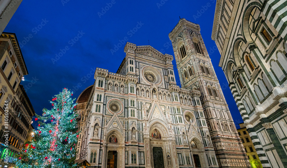 Florence during Christmas time, with the Cathedral of Santa Maria del Fiore and the Christmas Tree. Tuscany, Italy.