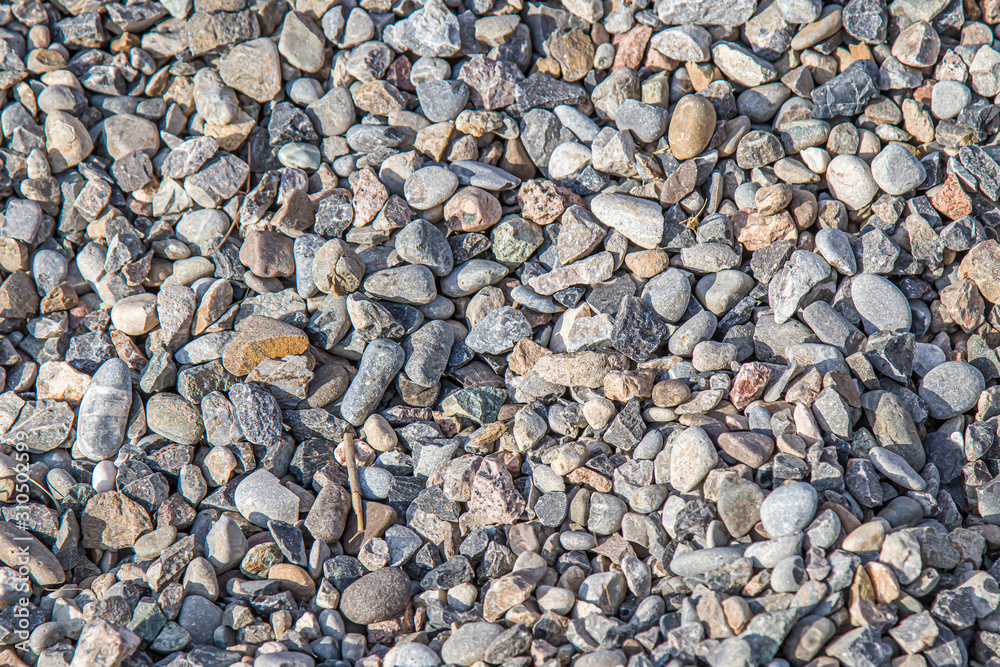 A large pile of building gravel outdoors as a background A large pile of building gravel outdoors as a background