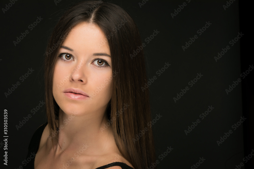 Portrait of beautiful young woman on black background Portrait of beautiful young woman on black background