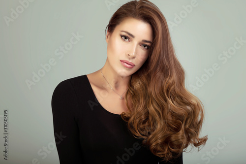 Beauty model with long healthy shiny brown hair