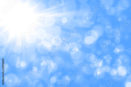 Blurred abstract background with light blue and white gradient.