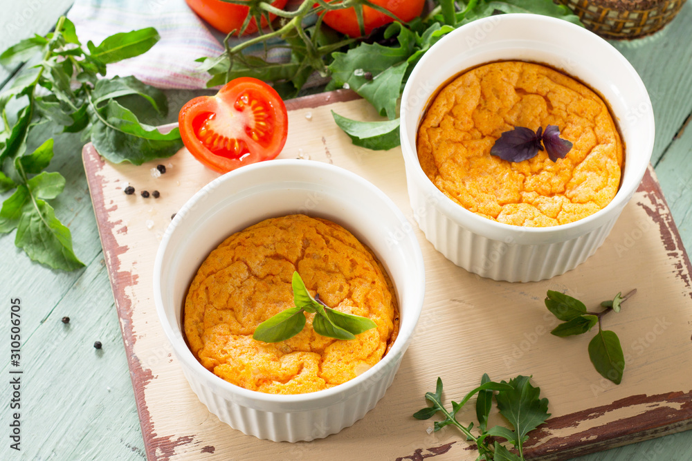 Summer breakfast. Diet and healthy food. Baked omelet with tomatoes on a kitchen wooden table. Summer breakfast. Diet and healthy food. Baked omelet with tomatoes on a kitchen wooden table.
