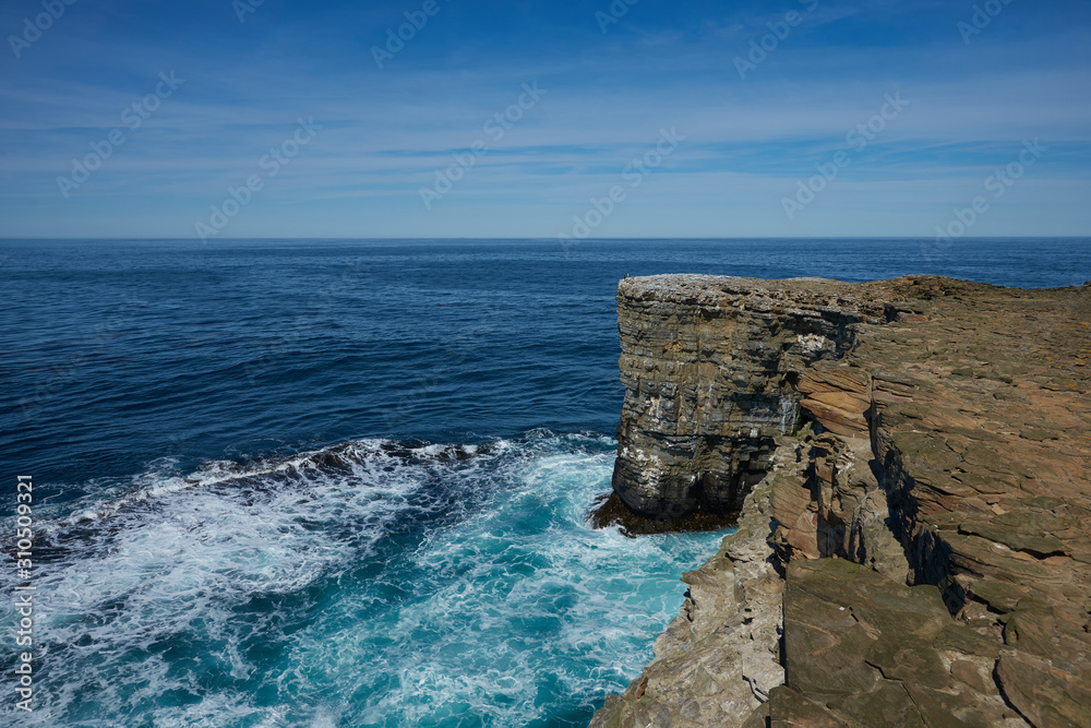 Cliffs along the coast of Sea Lion Island in the Falkland Islands. 