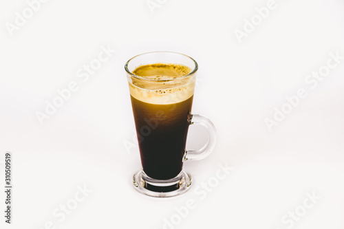 GLASS CUP OF COFFEE ON WHITE BACKGROUND