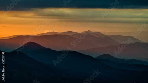 Splendid mountain sunrise. Mountains silhouettes on a beauty background. Bieszczady Mountains Poland Ukraine