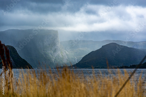 Rough and majestic view of the mountains in Norway around Måløy. Dramatic lighting