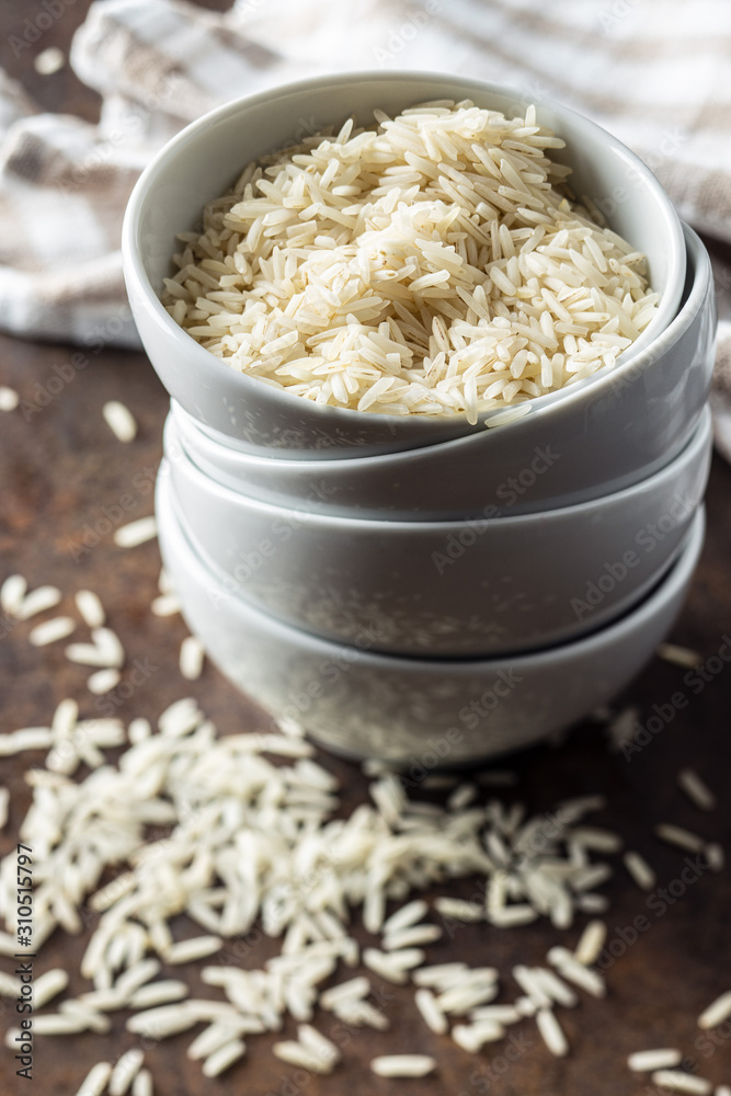 Uncooked indian long rice in bowl. Uncooked indian long rice in bowl.