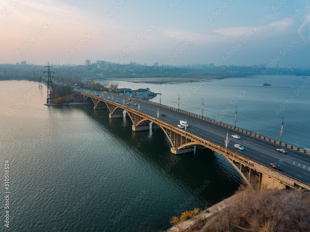 Aerial autumn Voronezh cityscape from drone flight height. View of the Vogresovsky bridge over Voronezh Water Reservoir