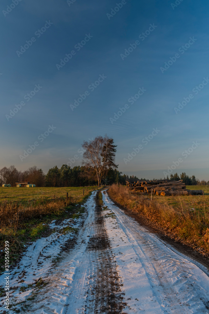 Path with snow in sunset evening near Hradek village