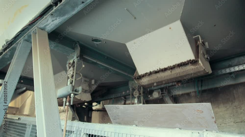 Exact moment of filling of product. The black colored product is in raw state and then will be passed under many processes and then it will transport to market. Exact moment of filling of product. The black colored product is in raw state and then will be passed under many processes and then it will transport to market.