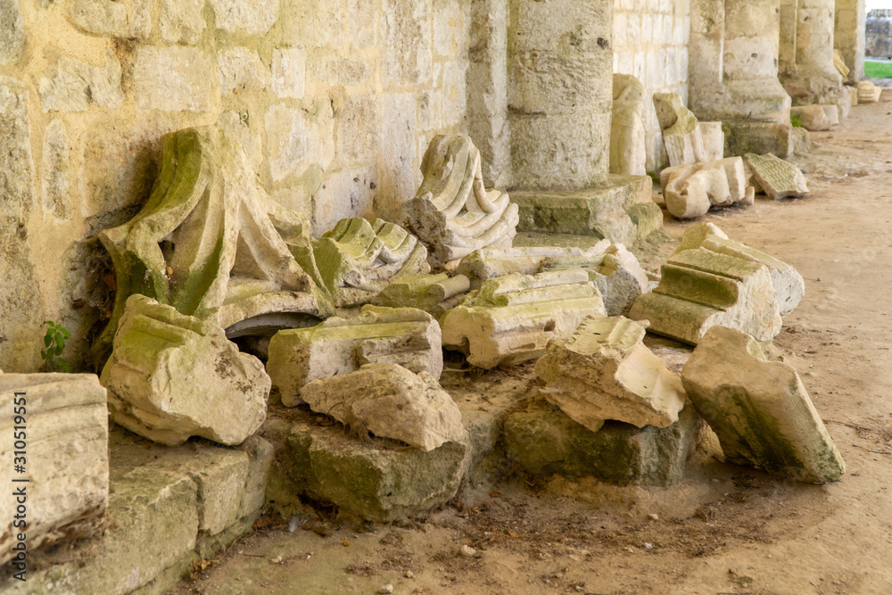 remains of broken stone pillars, in the ruins of Jumieges Abbey