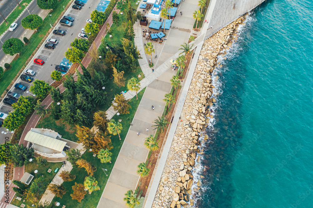 Limassol. Cyprus. Aerial top view of Limassol Molos Park, alley with palms for walking. Mediterranean sea coastline.