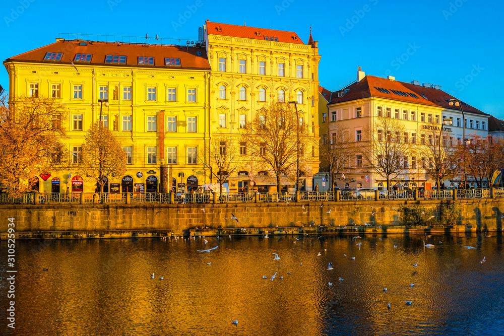 Fototapeta premium image of the embankment of the Vltava river in Prague at sunset
