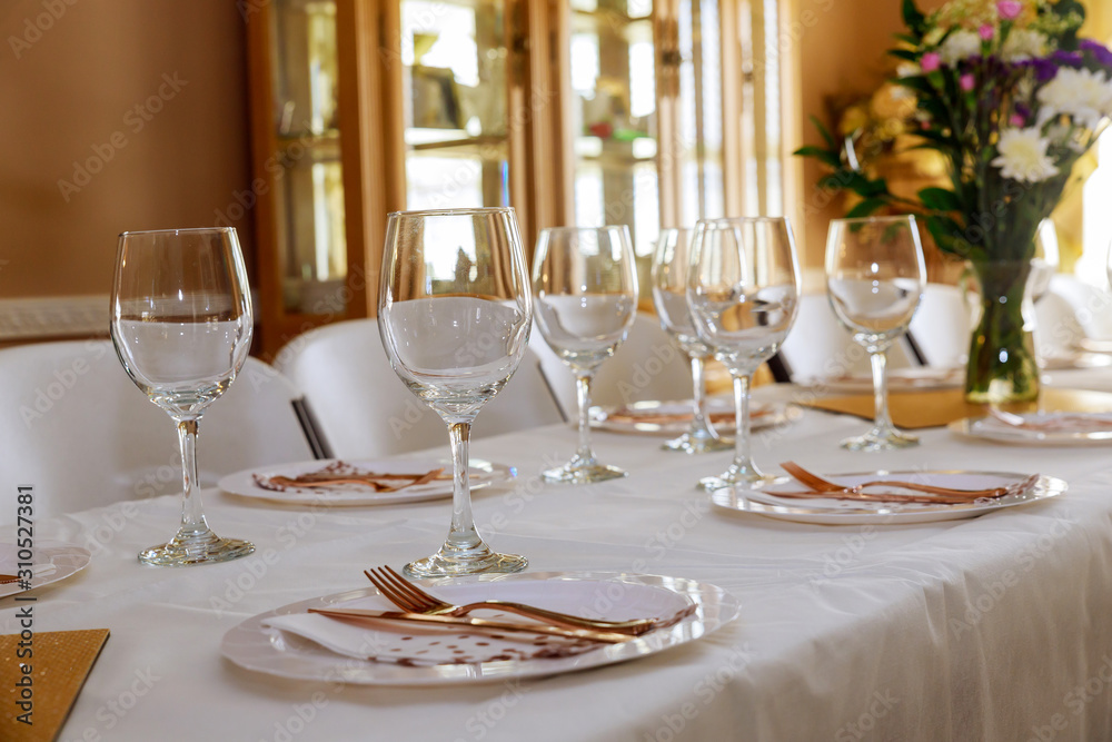 Festive table served for dinner or party in living room.