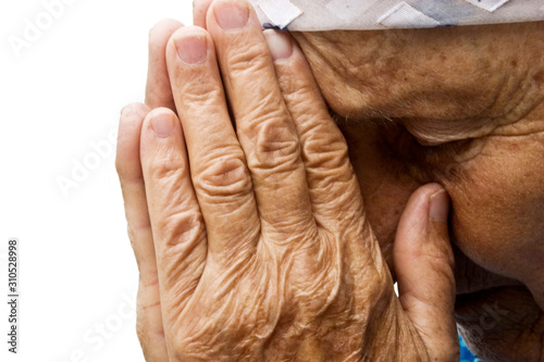 Grandma asking for help. Old grandmother praying to the Almighty