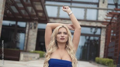 Seductive blonde poses at luxury house