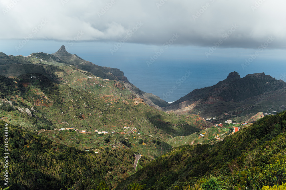 Fototapeta premium Small settlements between the mountain peaks on the Spanish island of Tenerife