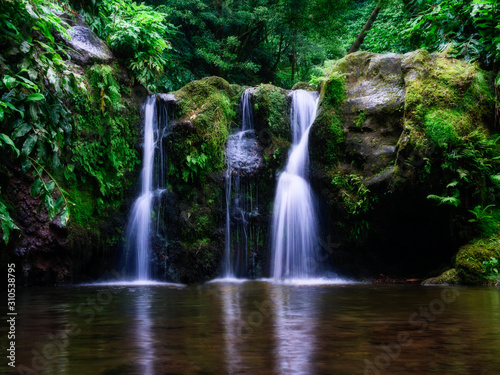 Long exposure image of beautiful waterfall in tropical environment