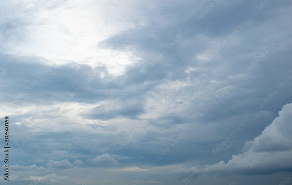 Dark storm clouds roll across the sky filling all the bright space Dark storm clouds roll across the sky filling all the bright space