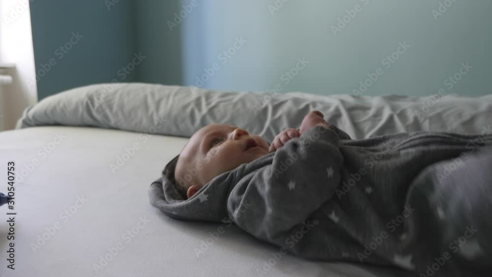 Baby Lying on Back Looking Upwards Happily Baby Lying on Back Looking Upwards Happily