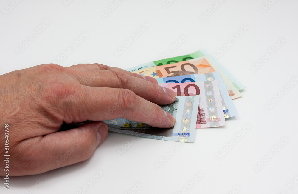 Euro bills and a hand above them Euro bills and a hand above them