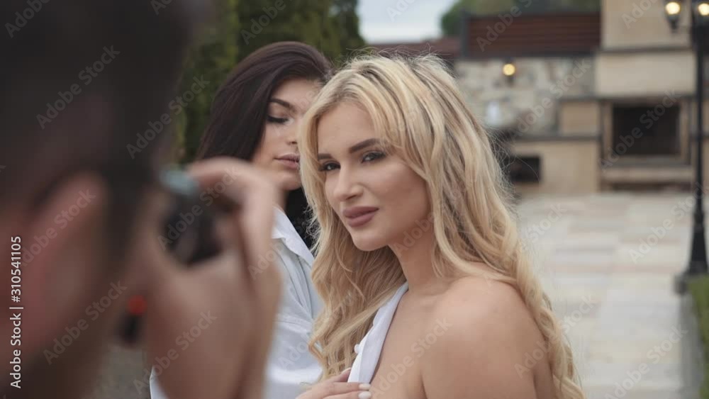 Two seductive girls pose during photo session outdoors Two seductive girls pose during photo session outdoors